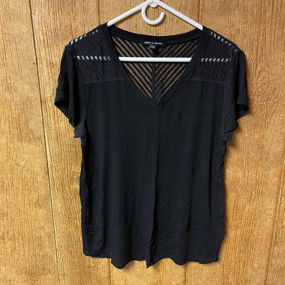 Soft black v neck short sleeve with sheer pattern detail at shoulders